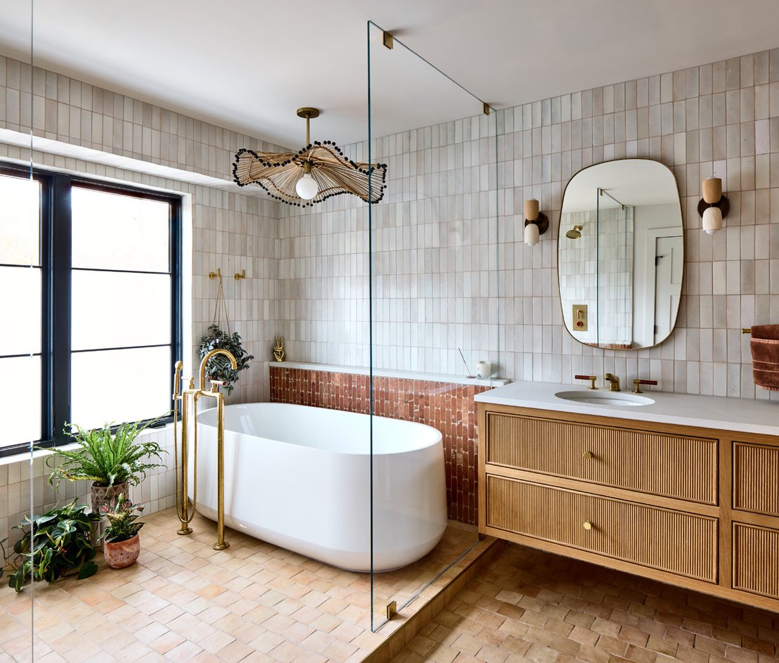 home remodel with terracotta and neutral tone bathroom with wet room and floating vanity