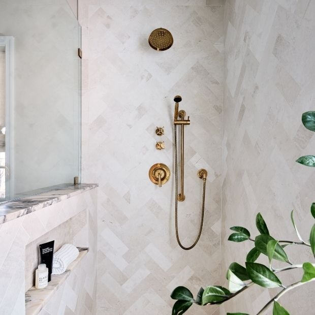 large walk in shower with brass shower head and built in shelf (1)