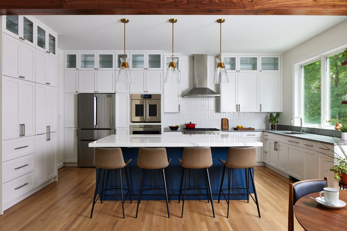 chevy chase kitchen remodel with white cabinets and bar stool seating at kitchen island
