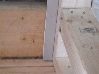Entry_10_-_3_Close-up_Fire_Code_Drywall_Between_Top_Plate_and_Second_Floor_Joists
