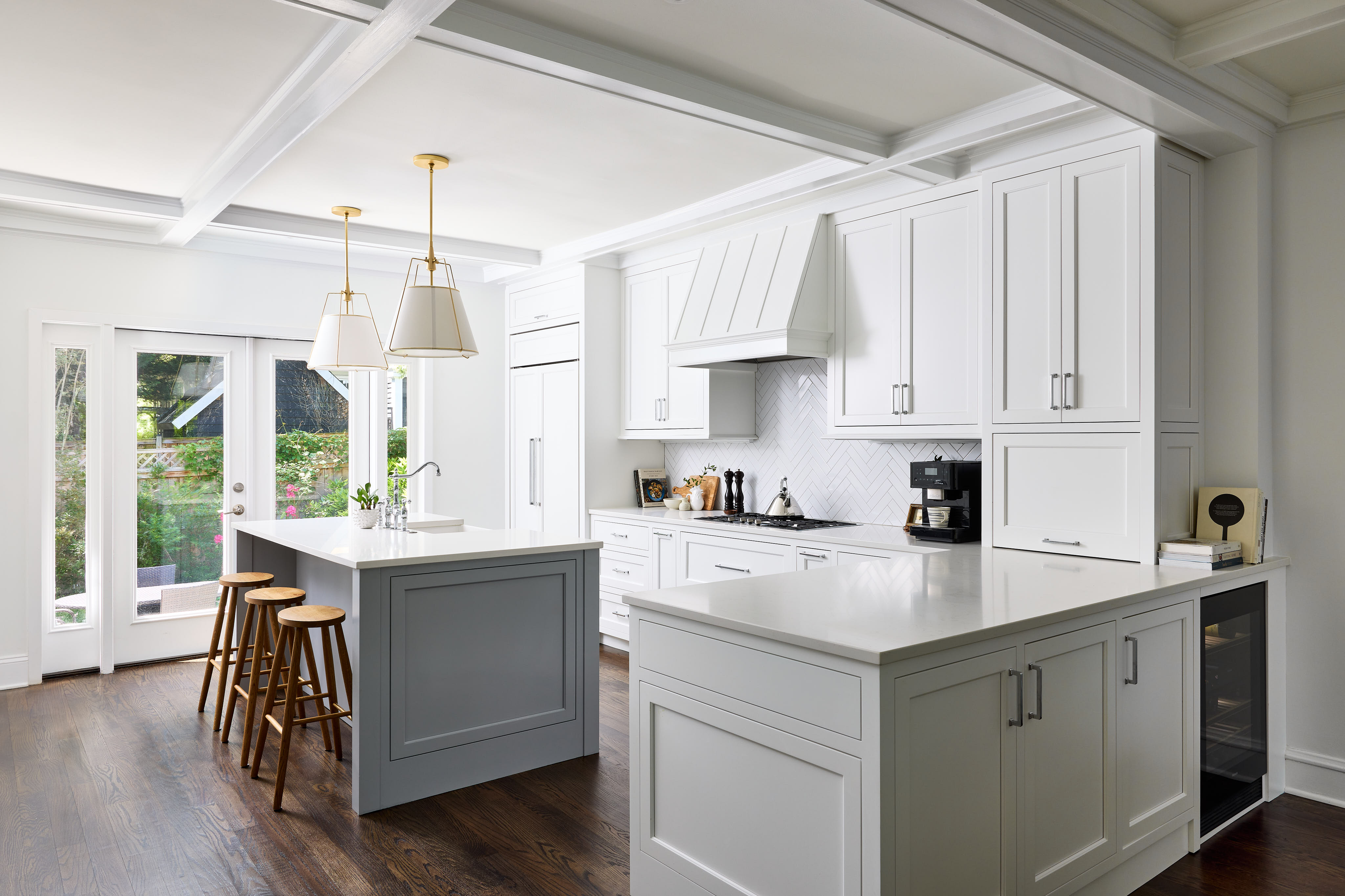 Chevy Chase kitchen remodel with white inset cabinetry, a gray island, coffered ceiling, and French doors leading outside. Chevy Chase kitchen remodel with white inset cabinetry, a gray island, coffered ceiling, and French doors leading outside.