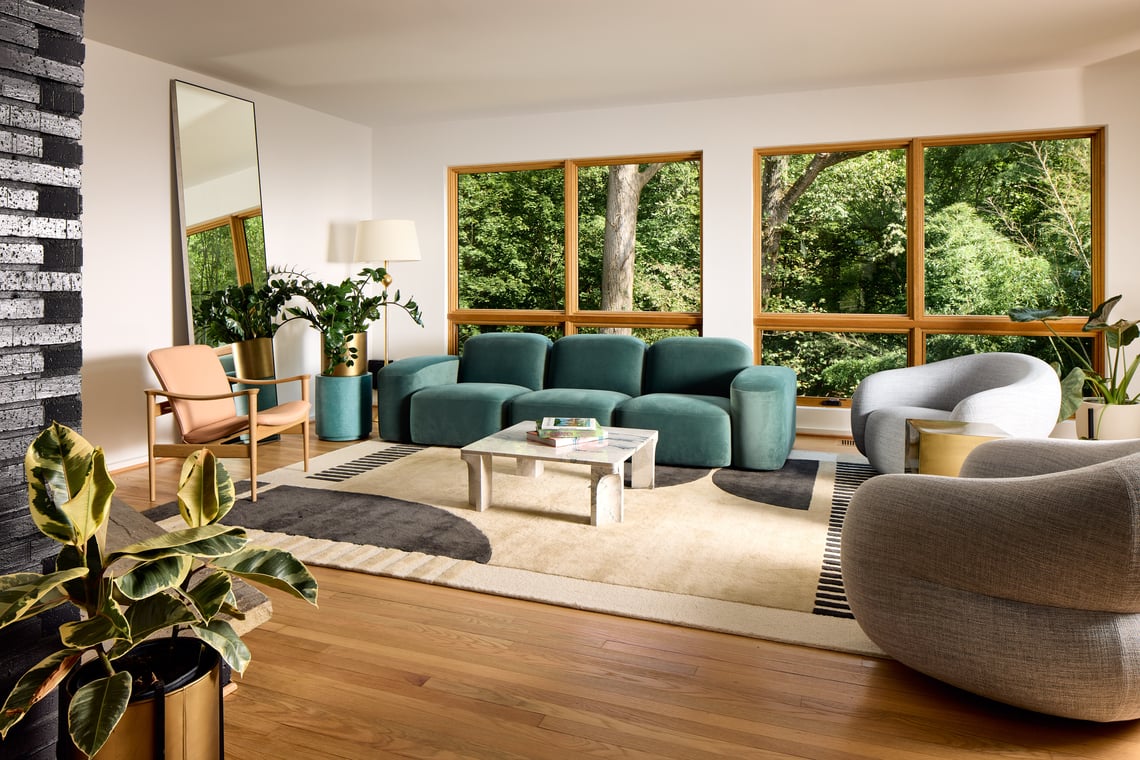 Whole-home pop-up addition in Somerset, Chevy Chase, Maryland showcasing a newly expanded second floor with dormers, fresh exterior siding, and updated windows on a traditional residential street.