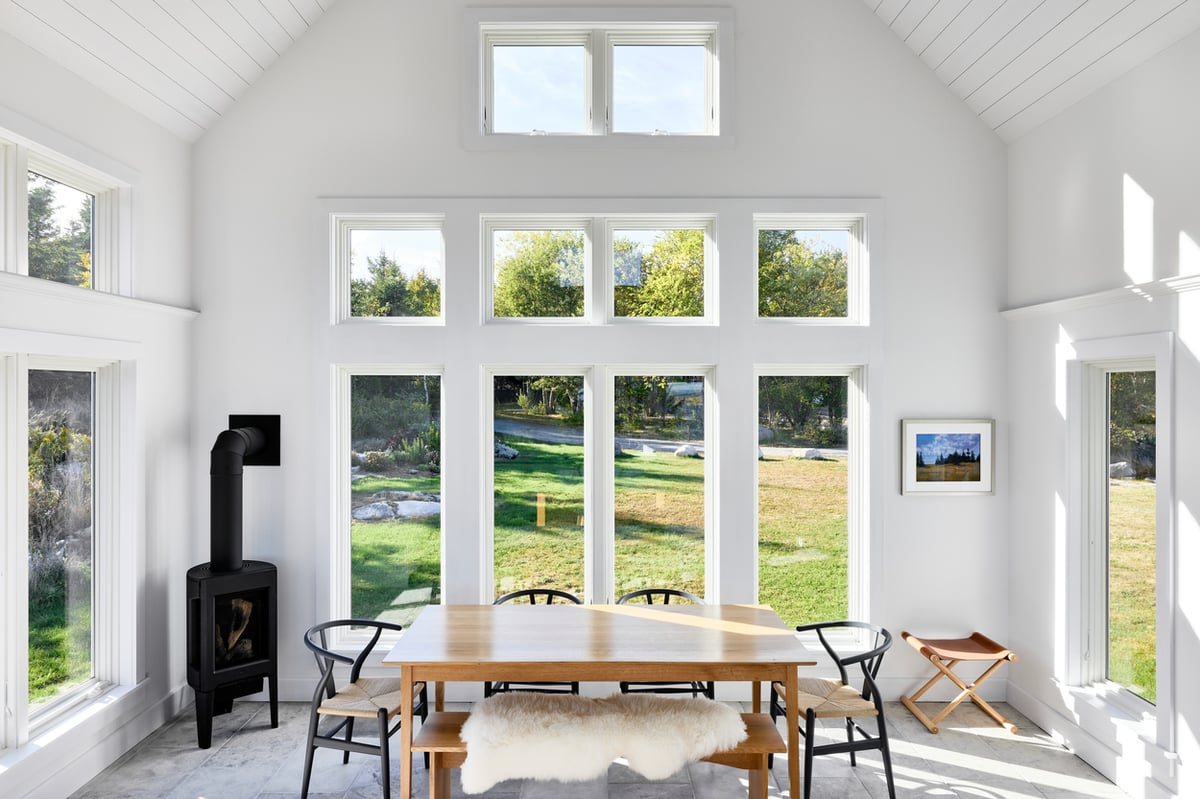 coastal kitchen addition with natural light and white walls