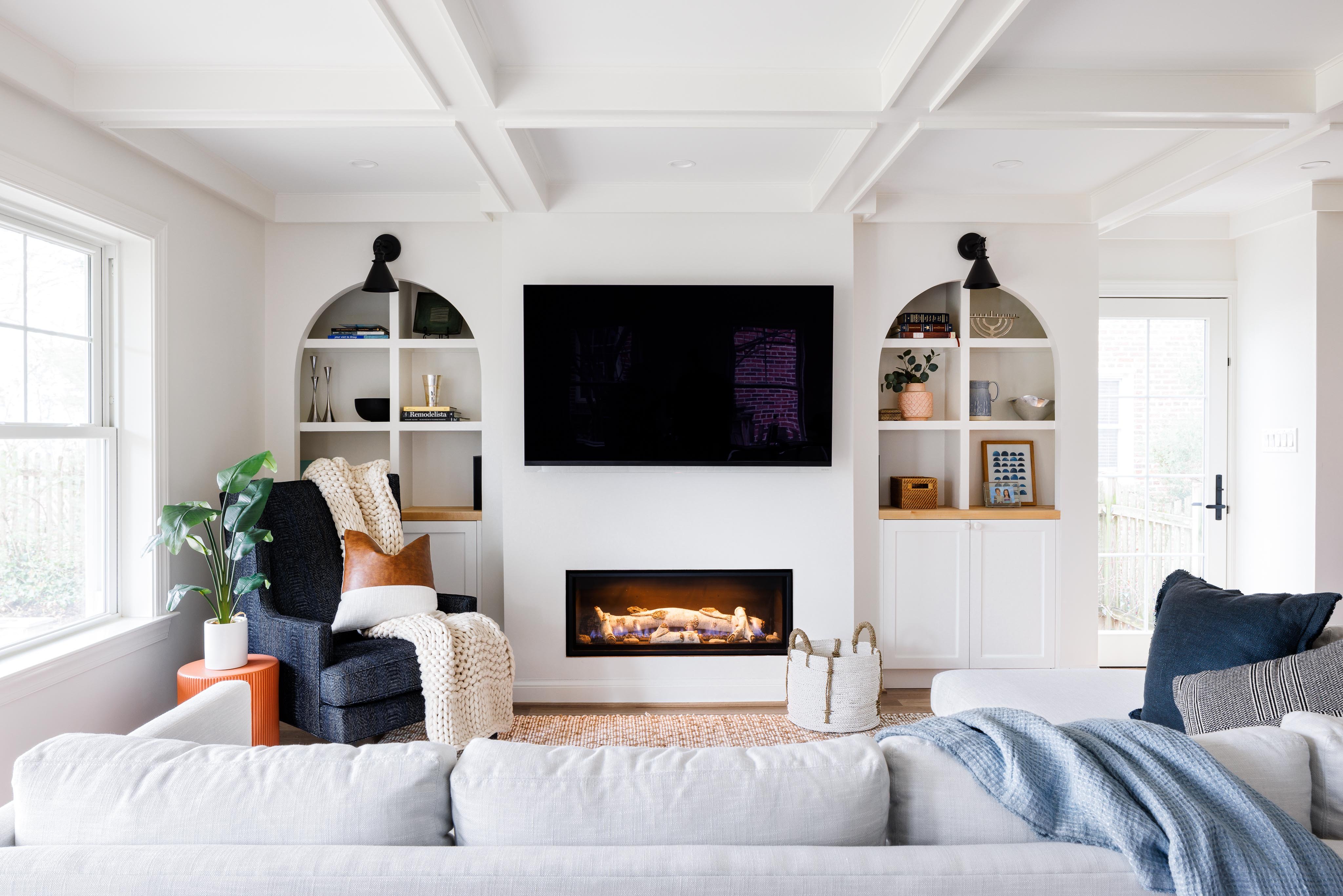 cozy modern living room renovation with fireplace and built in wall storage in davenport